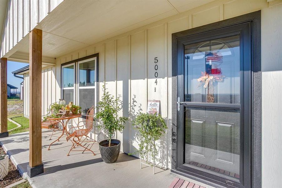 Front porch with sitting area to overlook the views of downtown Fort Worth off in the distance. Front porch with sitting area to overlook the views of downtown Fort Worth off in the distance.