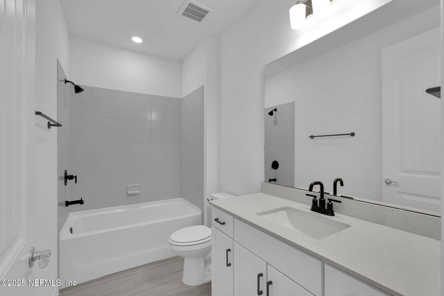 Furnished interior view inside a new home in Summer Bay at Grand Oaks, St. Augustine (Image 5). Furnished interior view inside a new home in Summer Bay at Grand Oaks, St. Augustine (Image 5).