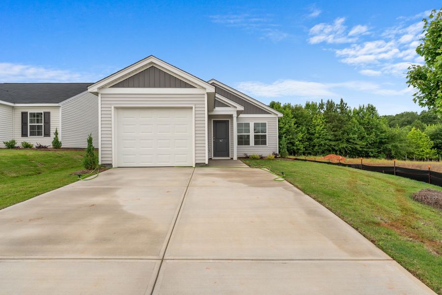 Front exterior of a new home in Evergreen, Spartanburg, SC, highlighting curb appeal (Image 1). Front exterior of a new home in Evergreen, Spartanburg, SC, highlighting curb appeal (Image 1).