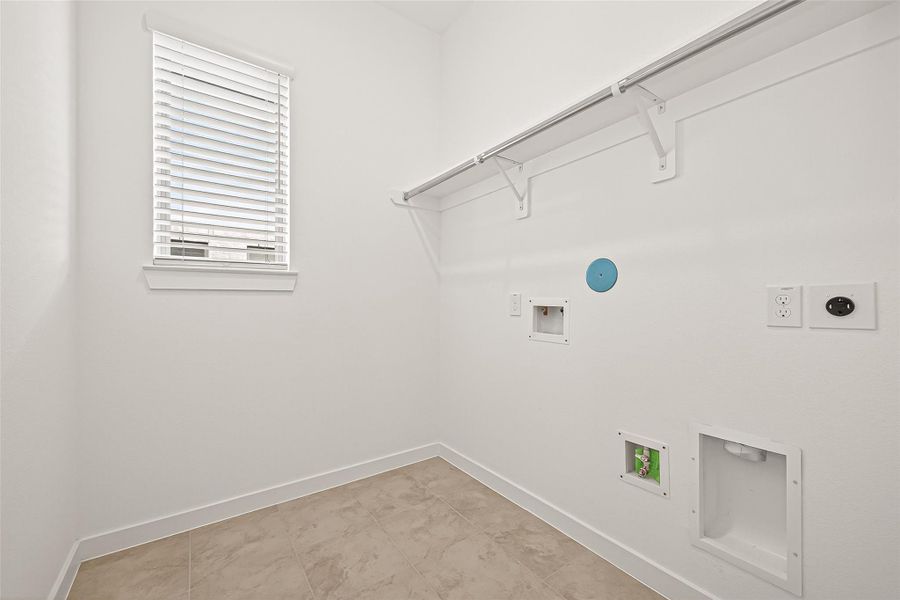 Laundry room with closet