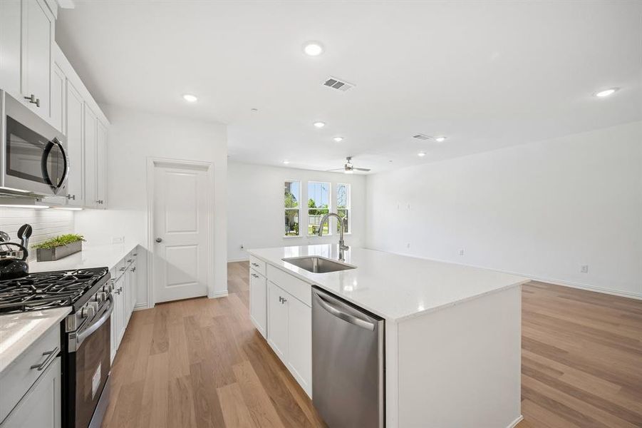 You'll enjoy ample storage and prep space in this lovely kitchen!