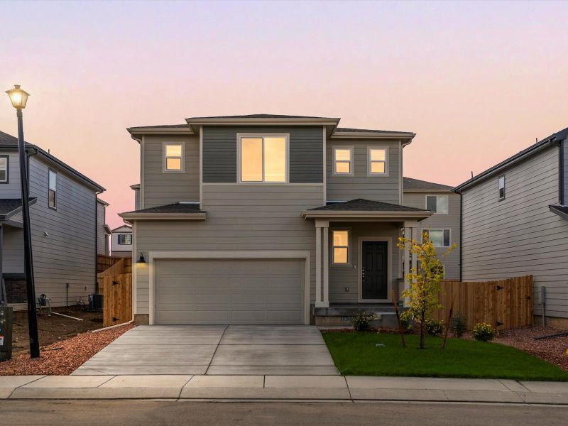 Front exterior of a new home in Lorson Ranch: The Trail Collection, Colorado Springs, CO, highlighting curb appeal (Image 1).