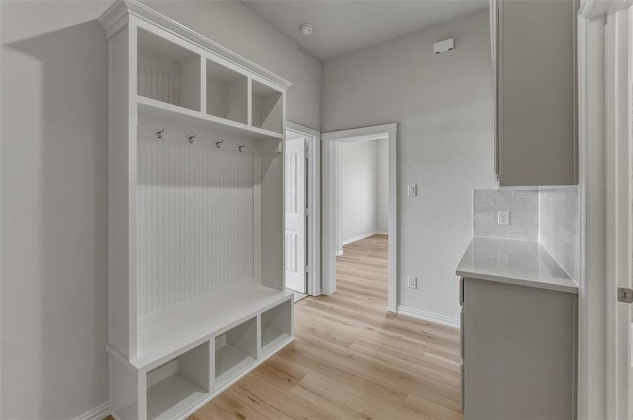 Entryway built-in storage bench with upper cubbies and coat hooks Entryway built-in storage bench with upper cubbies and coat hooks