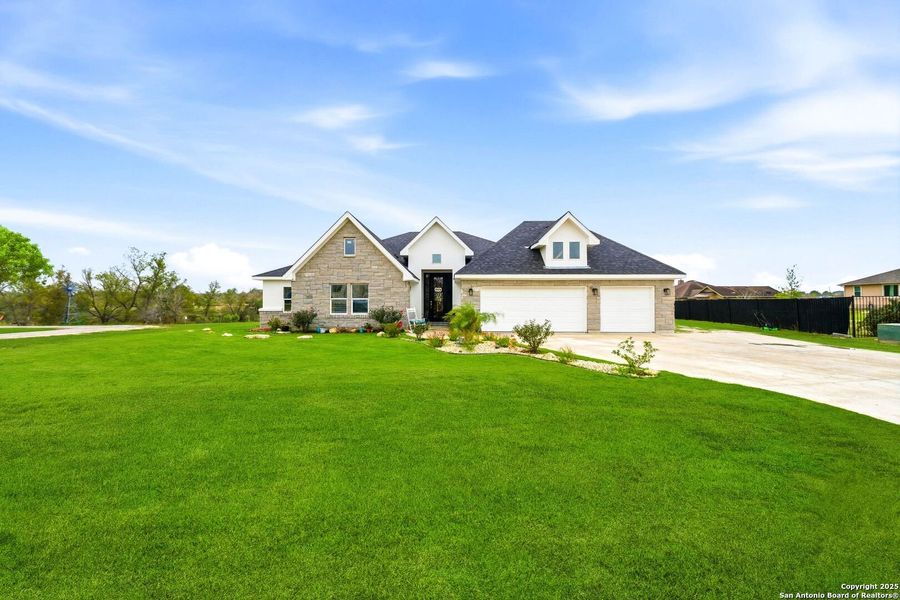 Front exterior of a new home in , Kyle, TX, highlighting curb appeal (Image 22). Front exterior of a new home in , Kyle, TX, highlighting curb appeal (Image 22).