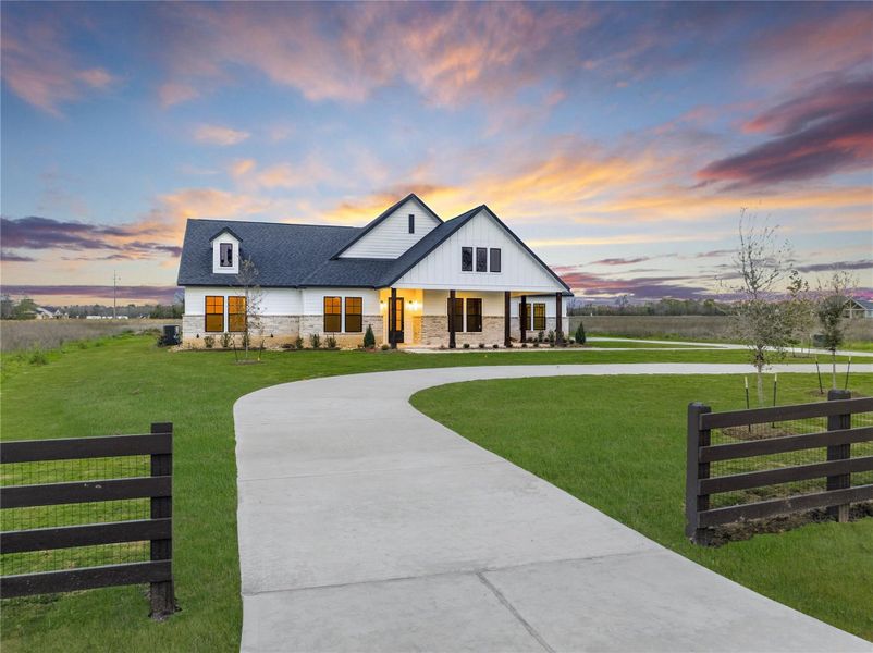 Front exterior of a new home in High Meadow Estates, New Waverly, TX, highlighting curb appeal (Image 25).