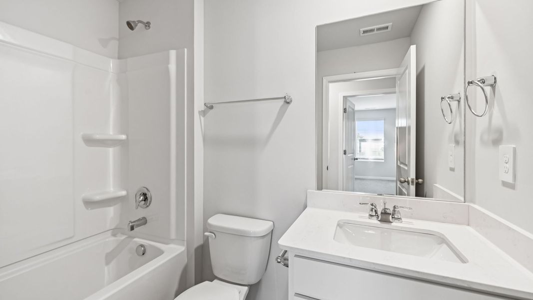 Representative furnished interior of a home built from the CABRAL by D.R. Horton in River Landing, Murfreesboro (Image 12).