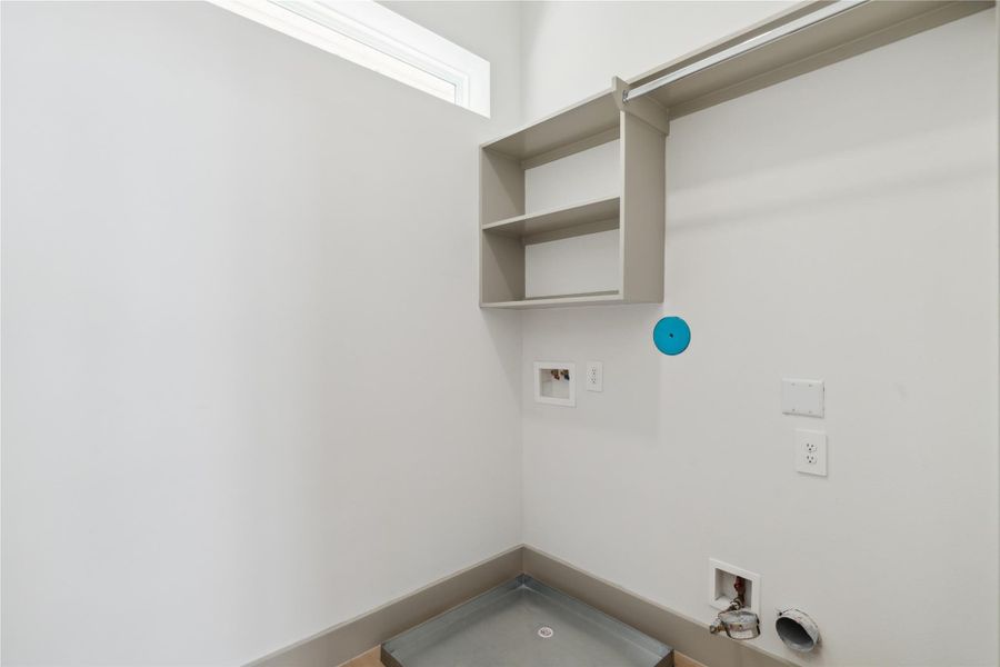 Laundry day feels less like a chore when it happens in a space this thoughtfully composed.