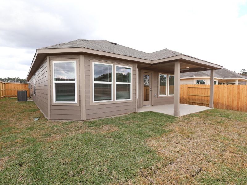 Exterior details and patio area of a home in Magnolia Ridge, Magnolia (Image 3).