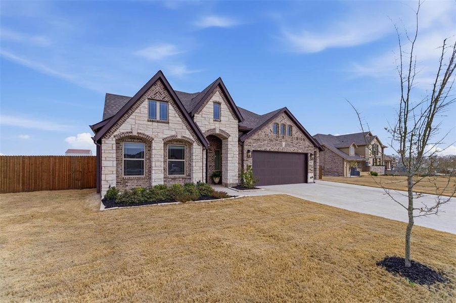 Front exterior of a new home in , Godley, TX, highlighting curb appeal (Image 23).