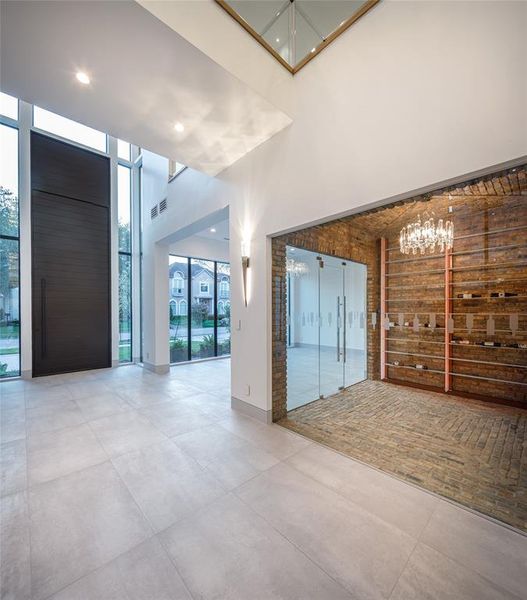 Entry foyer transitions into the climate control wine cellar