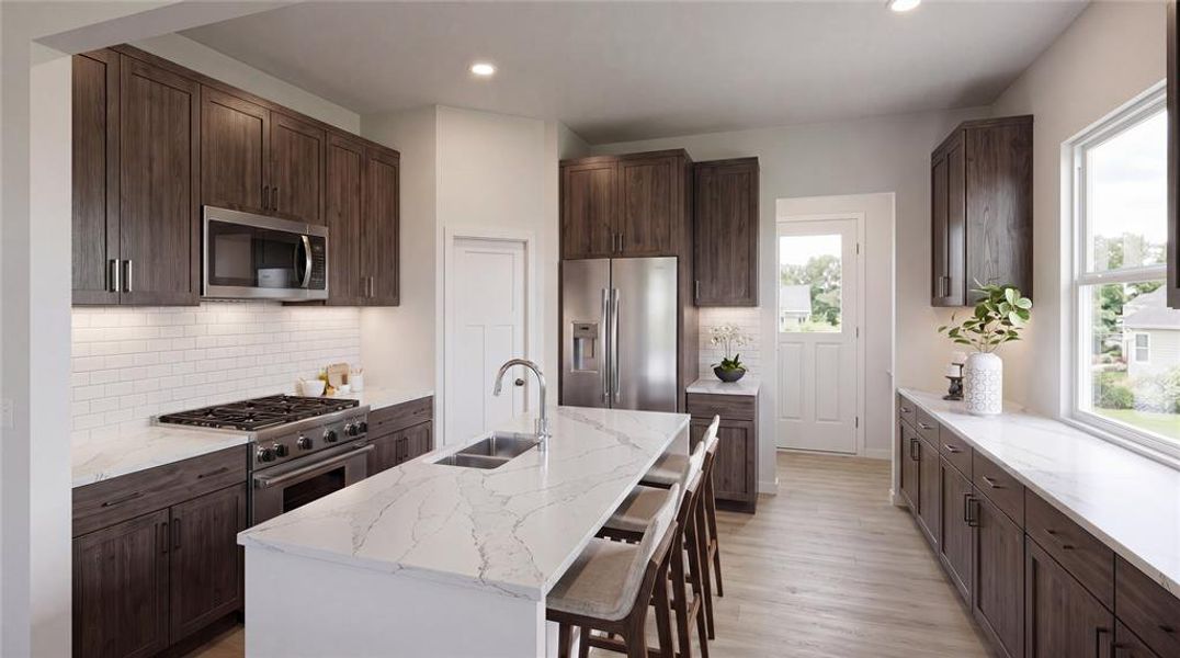 Contemporary kitchen featuring dark wood-finish cabinetry, quartz countertops, a subway tile backsplash, stainless steel appliances, and light wood-finish flooring