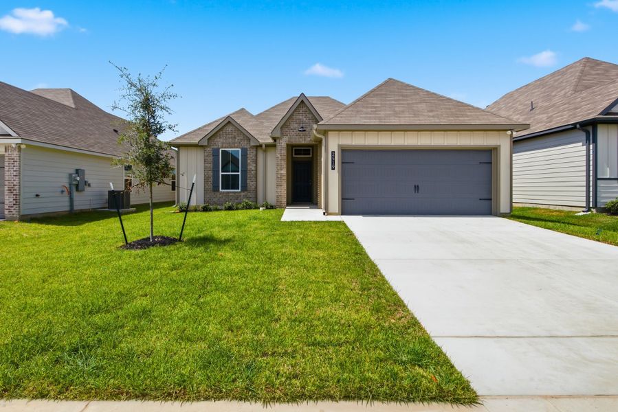 Front exterior of a new home in Pleasant Hill, Bryan, TX, highlighting curb appeal (Image 1). Front exterior of a new home in Pleasant Hill, Bryan, TX, highlighting curb appeal (Image 1).