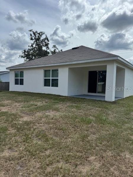 Exterior details and patio area of a home in Hernando County Spot Lots, Spring Hill (Image 24).