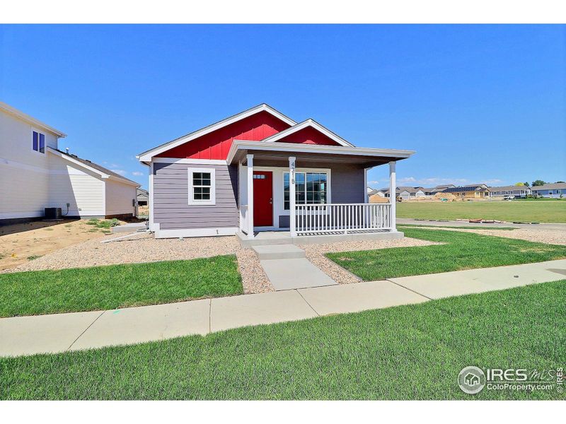 Front exterior of a new home in , Evans, CO, highlighting curb appeal (Image 2).