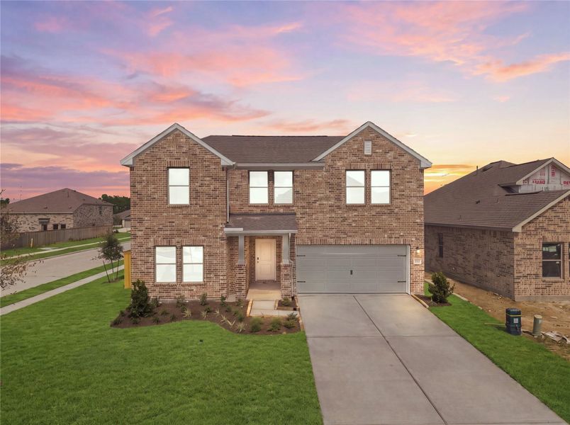 Front exterior of a new home in Windrose Green, Angleton, TX, highlighting curb appeal (Image 22). Front exterior of a new home in Windrose Green, Angleton, TX, highlighting curb appeal (Image 22).