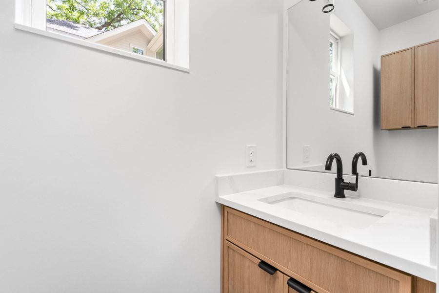 Bathroom with vanity and plenty of natural light Bathroom with vanity and plenty of natural light