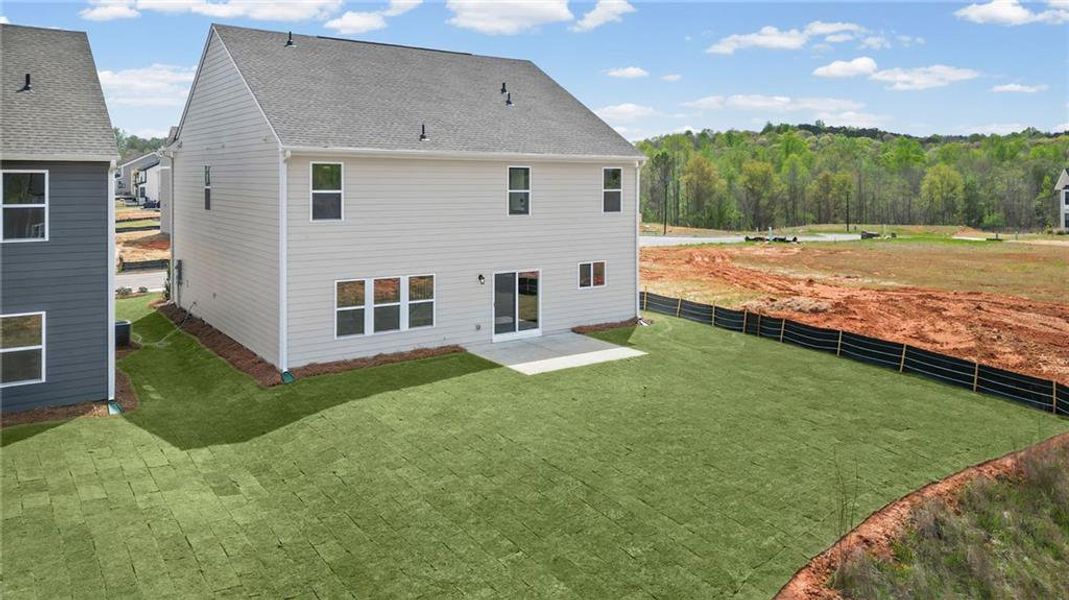 Exterior details and patio area of a home in Twin Lakes, Hoschton (Image 28).
