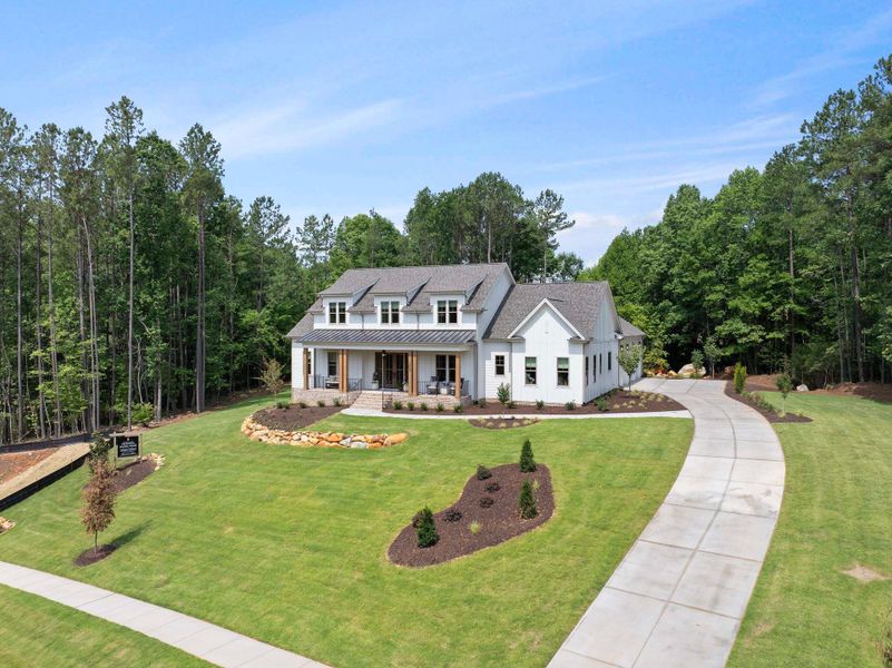 Representative exterior photo of a completed home built from the Oakmont American Farmhouse by Homes by Dickerson in Cattail, Clayton, NC (Image 7).