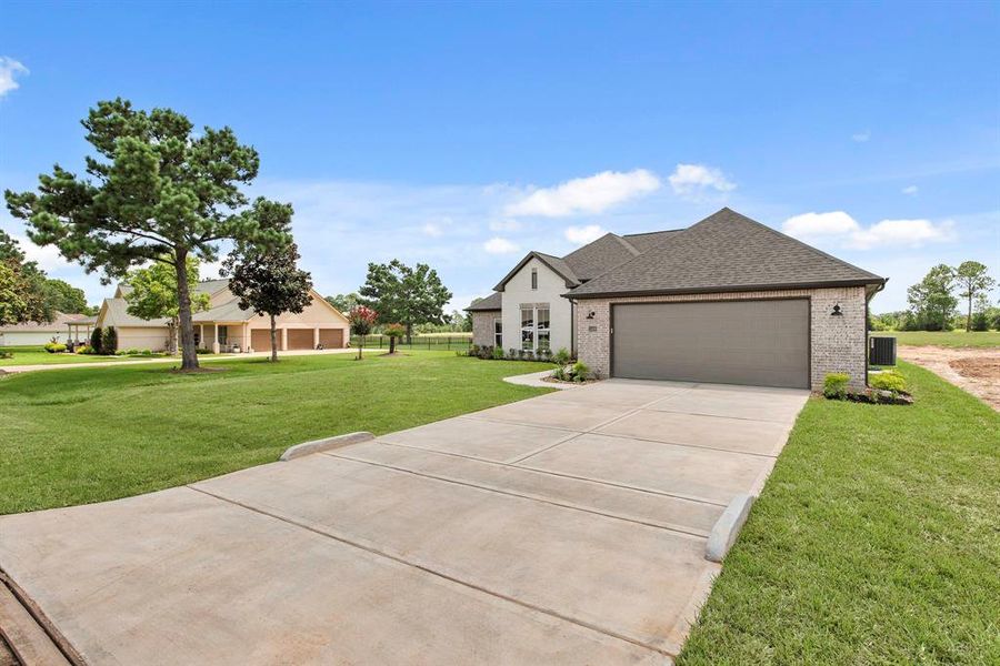 Front exterior of a new home in , Waller, TX, highlighting curb appeal (Image 21). Front exterior of a new home in , Waller, TX, highlighting curb appeal (Image 21).