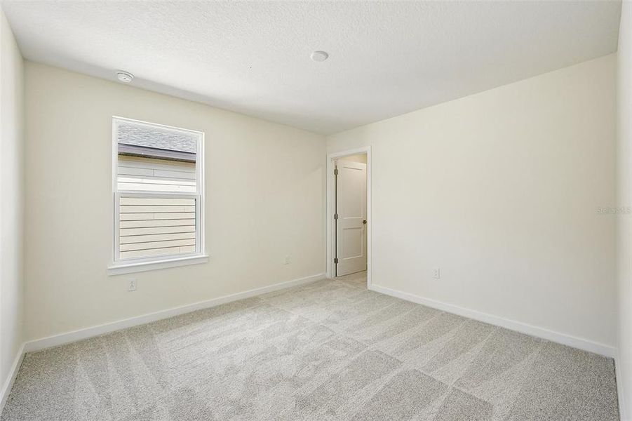 Spacious, unfurnished interior of a new home in Grasslands West, Lakeland (Image 31).