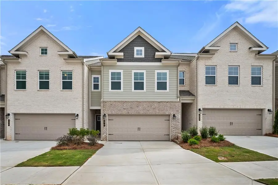 Front exterior of a new home in Langley Overlook, Loganville, GA, highlighting curb appeal (Image 1). Front exterior of a new home in Langley Overlook, Loganville, GA, highlighting curb appeal (Image 1).