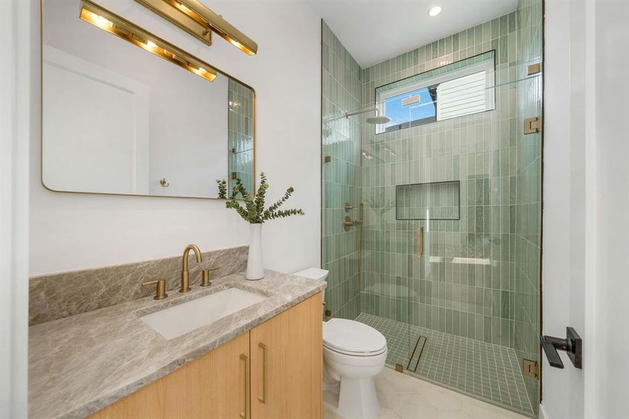 Bathroom with vanity and a shower stall Bathroom with vanity and a shower stall