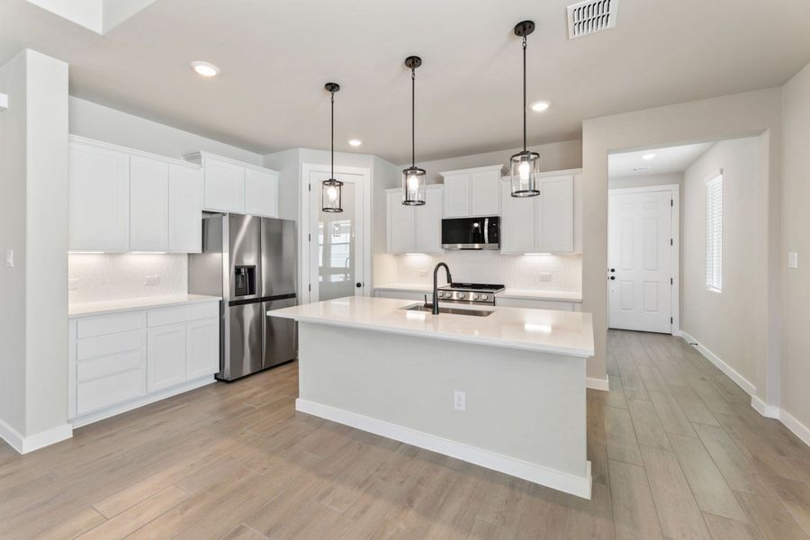 Representative furnished interior of a home built from the Pecos by Hakes Brothers in Highland Ridge, New Braunfels (Image 11).