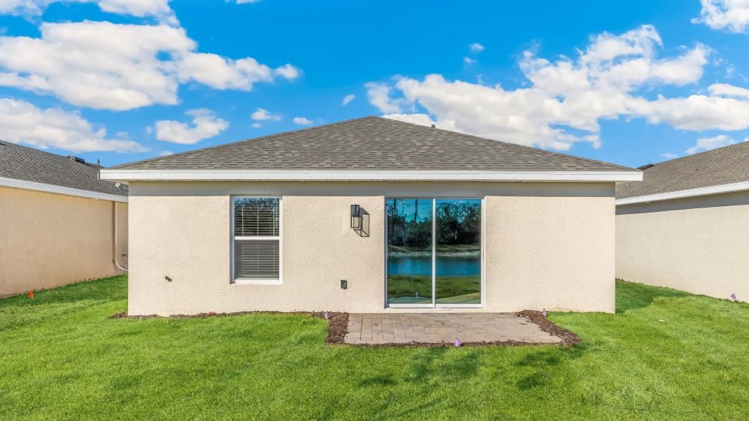 Exterior details and patio area of a home in Asher Park, Lehigh Acres (Image 2). Exterior details and patio area of a home in Asher Park, Lehigh Acres (Image 2).