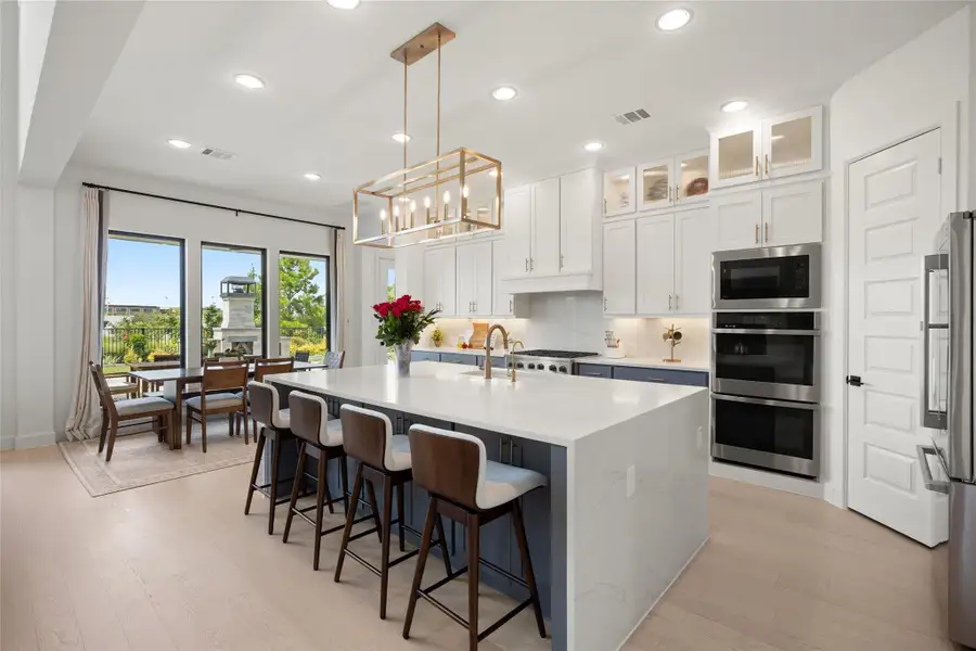 Furnished interior view inside a new home in Bridgeland, Cypress (Image 28).
