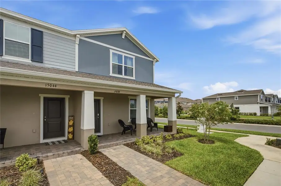 Front exterior of a new home in , Winter Garden, FL, highlighting curb appeal (Image 21). Front exterior of a new home in , Winter Garden, FL, highlighting curb appeal (Image 21).
