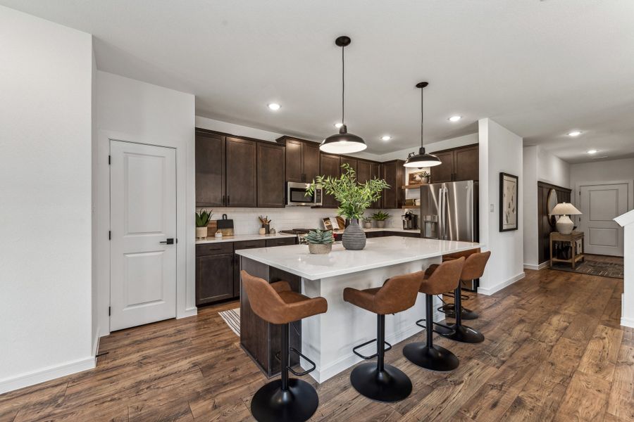 Kitchen with pendant lighting and floating shelves Kitchen with pendant lighting and floating shelves