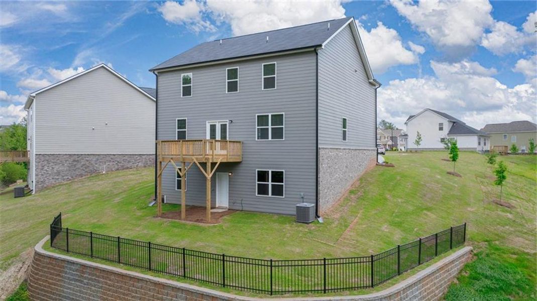 Front exterior of a new home in Locust Grove Station - Cedar Ridge, Locust Grove, GA, highlighting curb appeal (Image 2). Front exterior of a new home in Locust Grove Station - Cedar Ridge, Locust Grove, GA, highlighting curb appeal (Image 2).