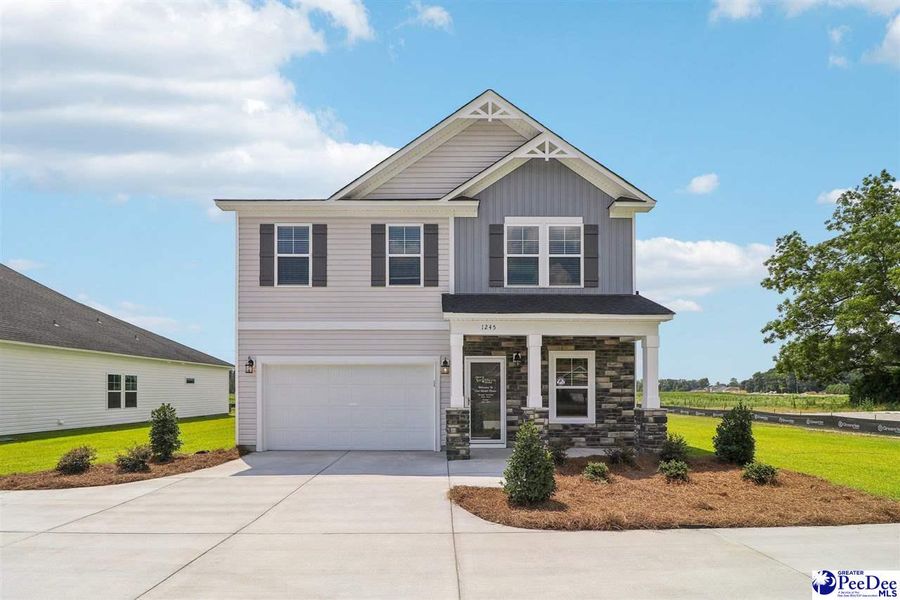 Front exterior of a new home in Southern Columns, Florence, SC, highlighting curb appeal (Image 1).