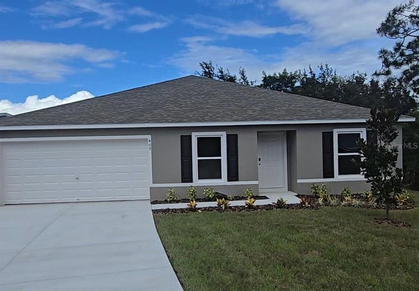 Front exterior of a new home in Poinciana, Poinciana, FL, highlighting curb appeal (Image 1). Front exterior of a new home in Poinciana, Poinciana, FL, highlighting curb appeal (Image 1).