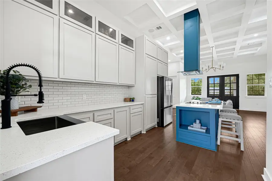 Expansive kitchen with modern design, featuring ample storage, sleek countertops, and an inviting island for entertaining.