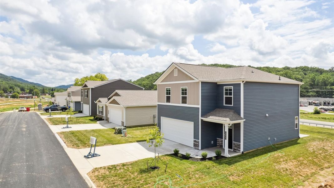 Front exterior of a new home in Emory Creek, Harriman, TN, highlighting curb appeal (Image 2). Front exterior of a new home in Emory Creek, Harriman, TN, highlighting curb appeal (Image 2).