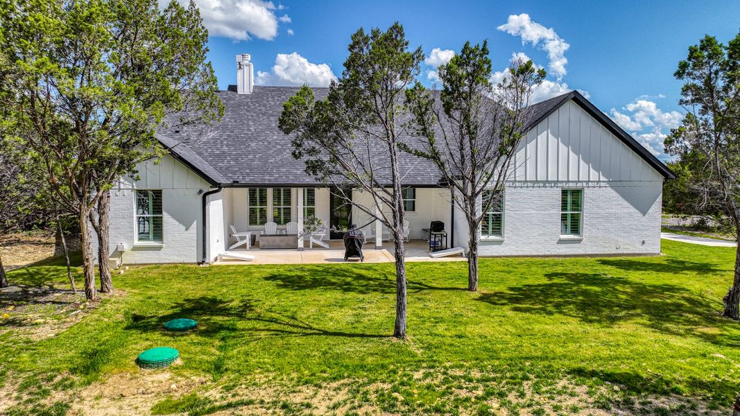 Representative exterior photo of a completed home built from the Lakeshore by Zeal Home Builders in Oak Water Ranch, Granbury, TX (Image 17). Representative exterior photo of a completed home built from the Lakeshore by Zeal Home Builders in Oak Water Ranch, Granbury, TX (Image 17).