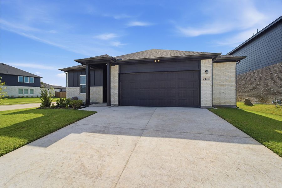 Front exterior of a new home in Sagebrook, Argyle, TX, highlighting curb appeal (Image 2).