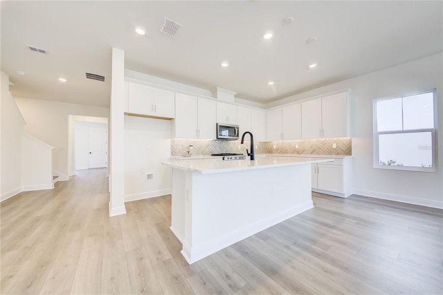 Furnished interior view inside a new home in Bungalow Walk at Lakewood Ranch, Sarasota (Image 9).