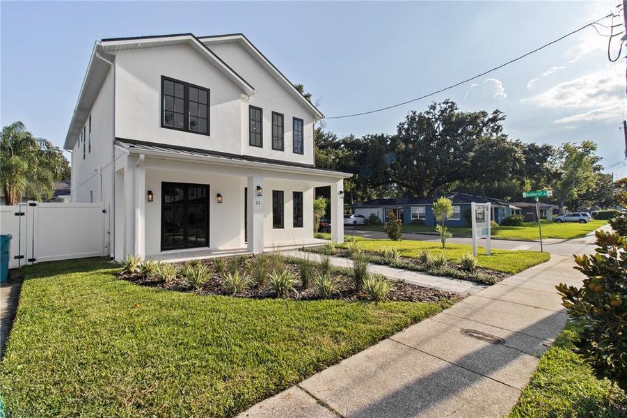 Front exterior of a new home in College Park, Orlando, FL, highlighting curb appeal (Image 1). Front exterior of a new home in College Park, Orlando, FL, highlighting curb appeal (Image 1).