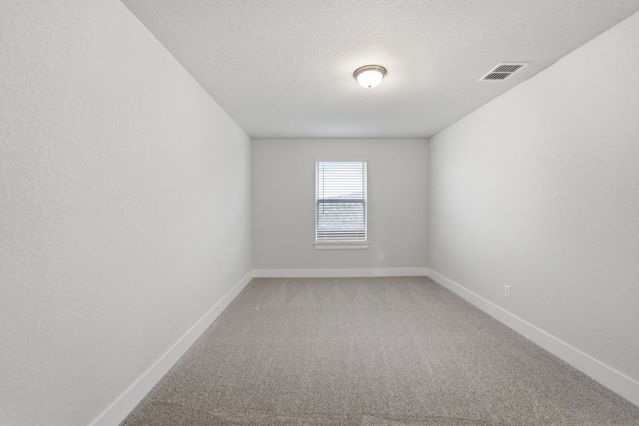 Spacious, unfurnished interior of a new home in The Woodlands at Medina Hills, Mico (Image 37).