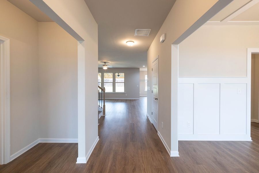 The inviting foyer opens up to the formal dining room