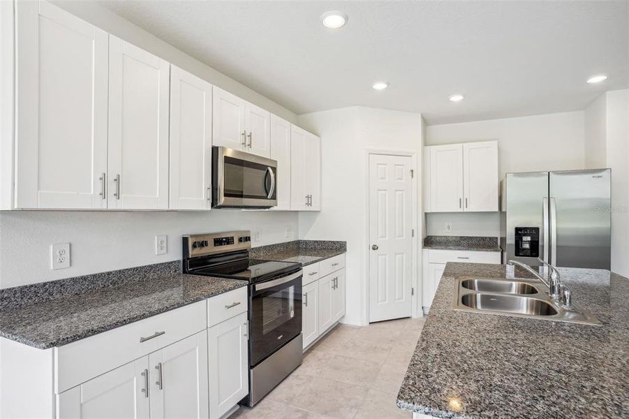 Furnished interior view inside a new home in Lake Deer Estates - Signature Series, Poinciana (Image 6). Furnished interior view inside a new home in Lake Deer Estates - Signature Series, Poinciana (Image 6).