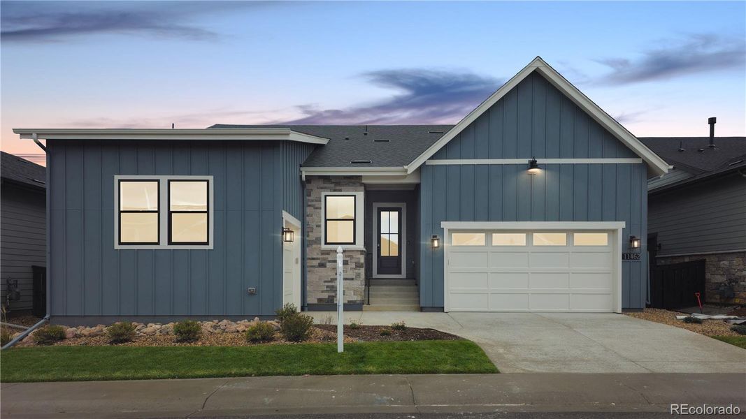 Front exterior of a new home in Reflection at Solstice, Littleton, CO, highlighting curb appeal (Image 2).