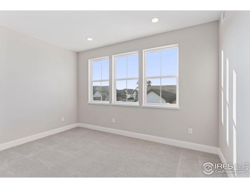 Spacious, unfurnished interior of a new home in Harvest LiteLuxe, Berthoud (Image 16).