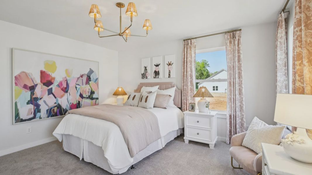 Bedroom with carpet and windows