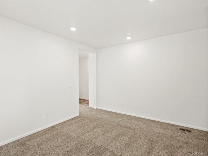 Spacious, unfurnished interior of a new home in Ridgeline Vista: The Flora Collection, Brighton (Image 31).