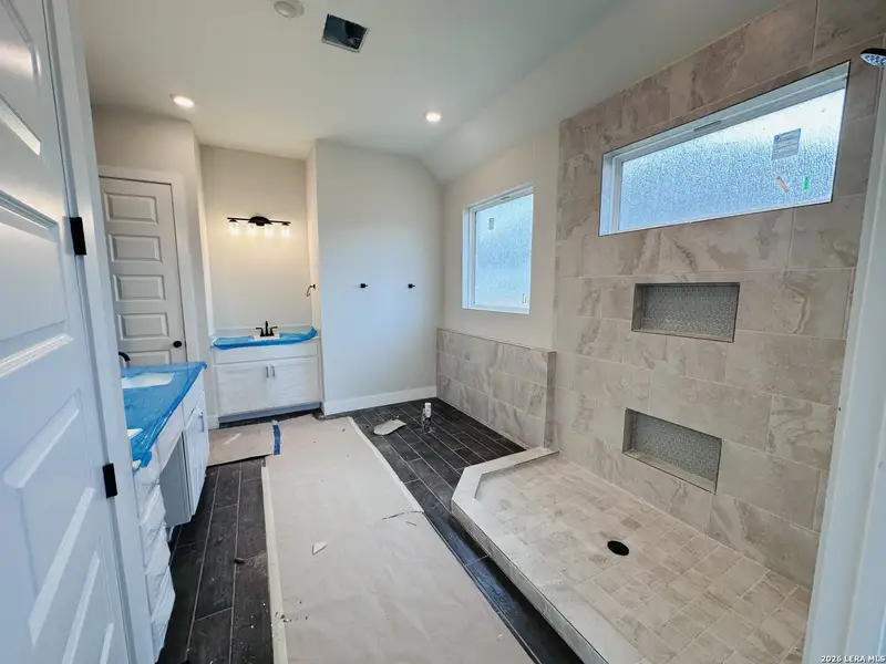 In-progress construction of a new home in Village at Three Oaks, Seguin, TX (Image 15).