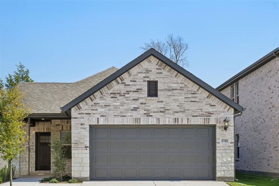 Front exterior of a new home in Eastridge - Spring Series, McKinney, TX, highlighting curb appeal (Image 2). Front exterior of a new home in Eastridge - Spring Series, McKinney, TX, highlighting curb appeal (Image 2).