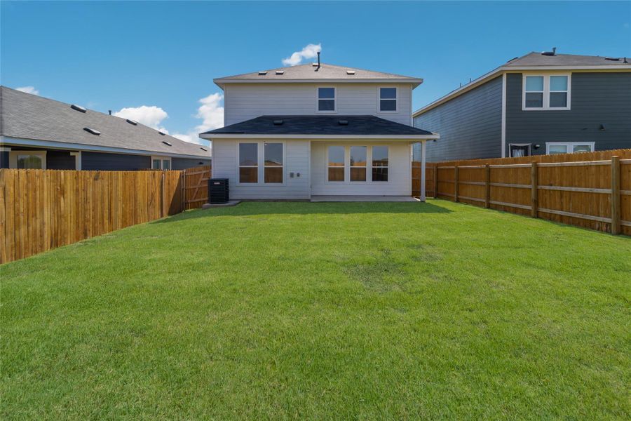 Front exterior of a new home in Marigold, Uhland, TX, highlighting curb appeal (Image 15). Front exterior of a new home in Marigold, Uhland, TX, highlighting curb appeal (Image 15).